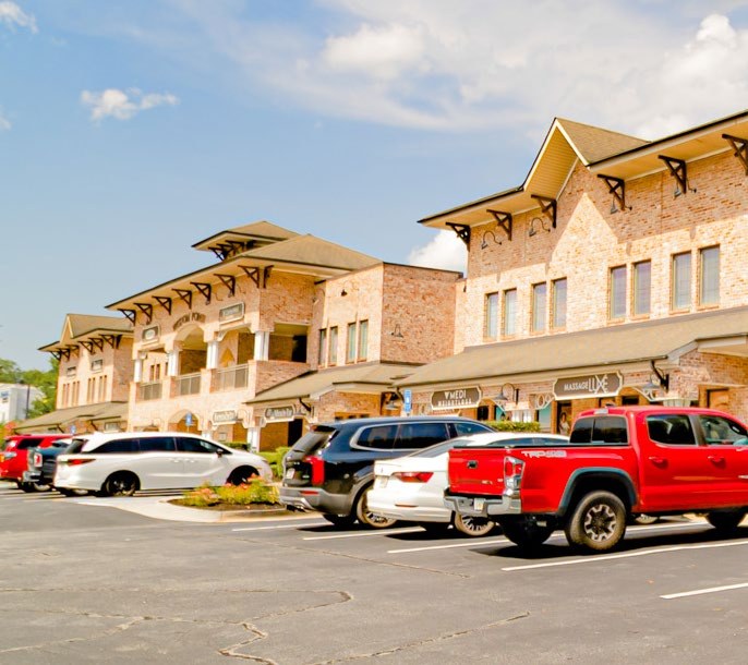 North elevation of Wisdom Pointe Village with mature landscaping