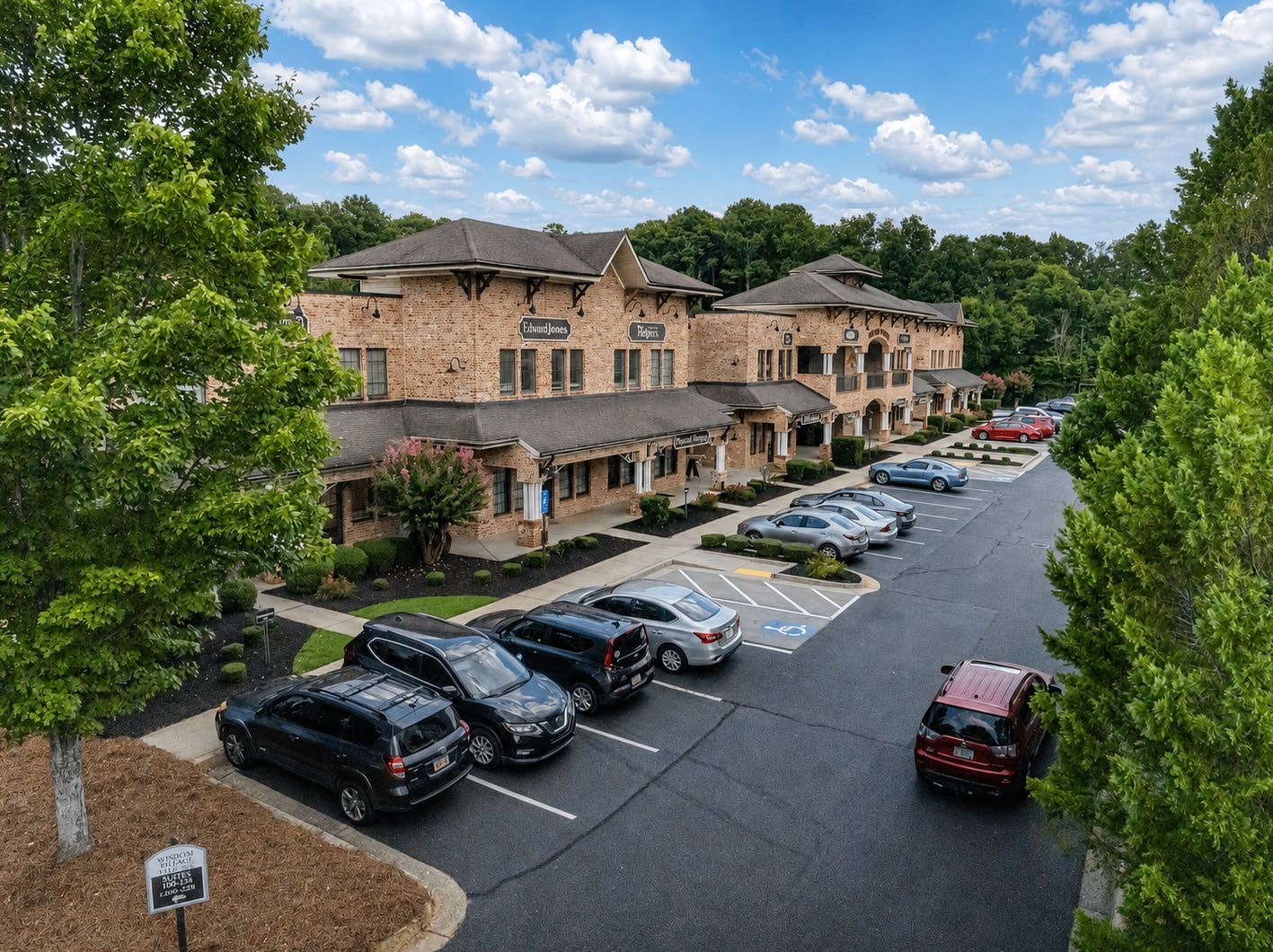 Elevated view of the Wisdom Pointe Village parking field and landscaping